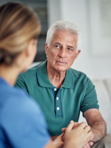 Concerned man talking with doctor